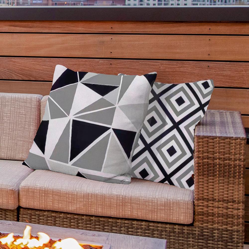 Black stylish and water-resistant outdoor pillow cover for home or garden furniture.